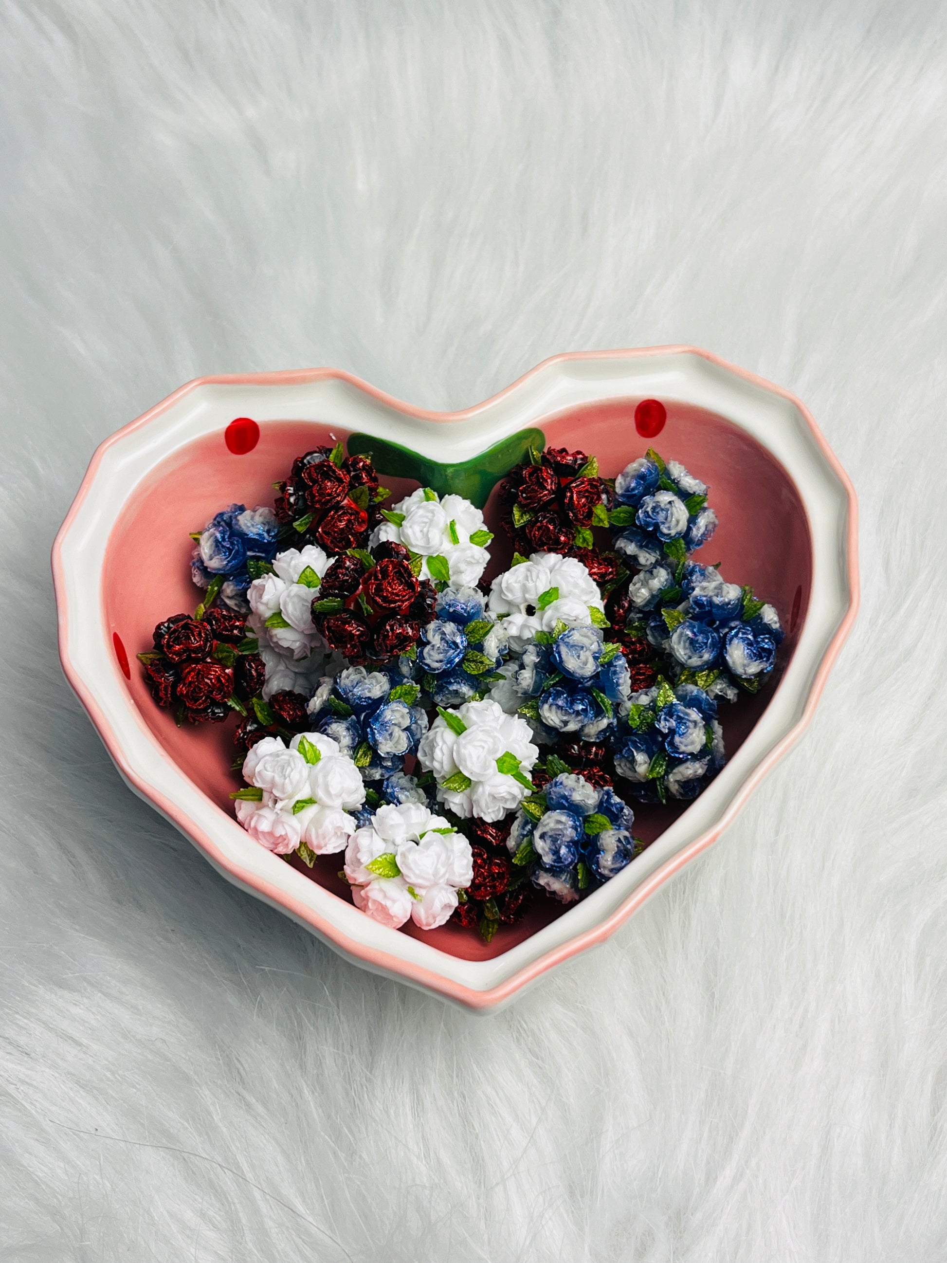 Flower beads with green leaves.