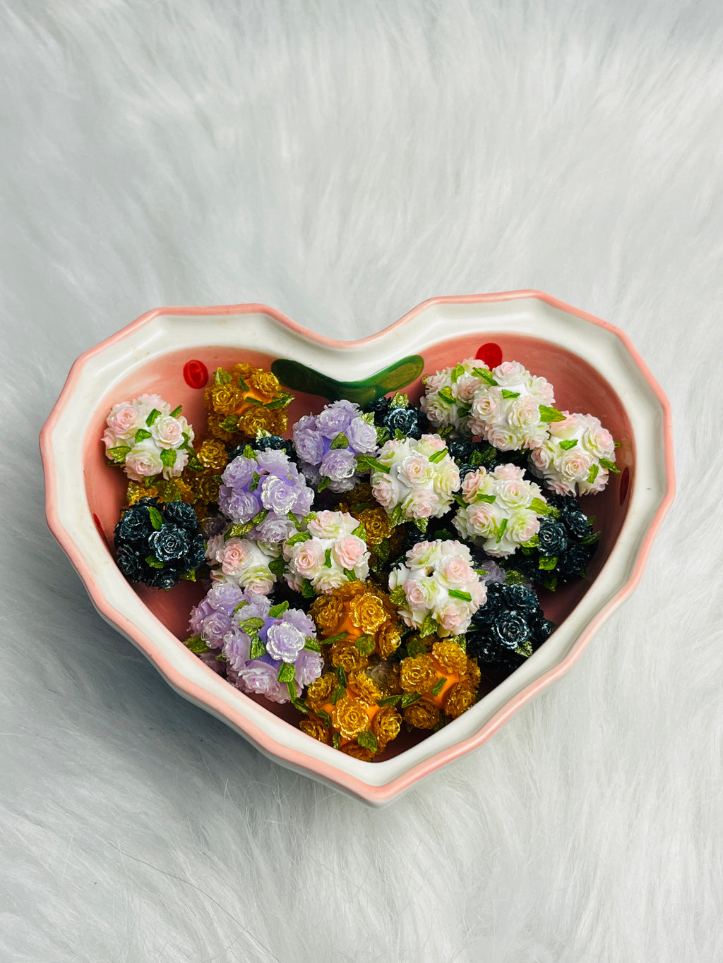 Flower beads with green leaves.