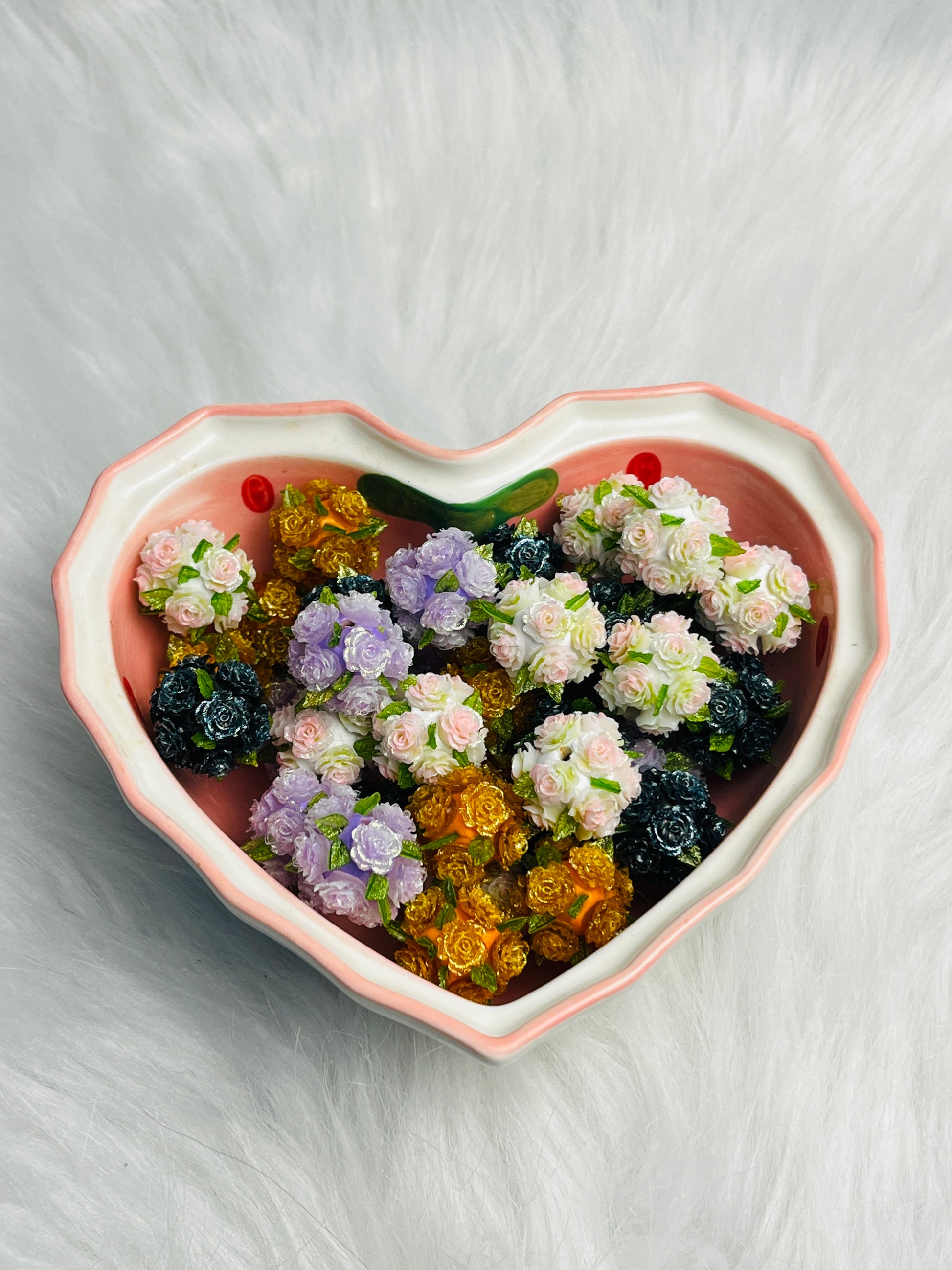 Flower beads with green leaves.